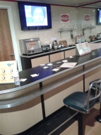 Lunch counter with segregation news playing on TV.