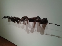 "If the Leader Only Knew" by Hank Willis Thomas -- Sculpture of hands protruding from the wall and grasping a strand of barbed wire.