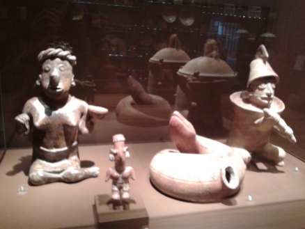 Three figures and a snake pitcher from the Mesoamerican collection.